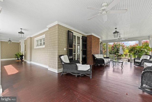 wooden terrace featuring ceiling fan