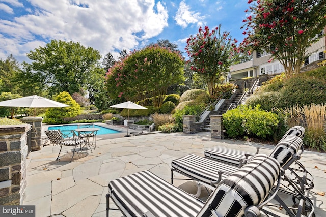 view of patio / terrace featuring a community pool