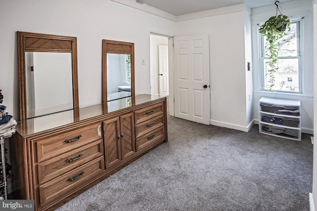 carpeted bedroom with white fridge