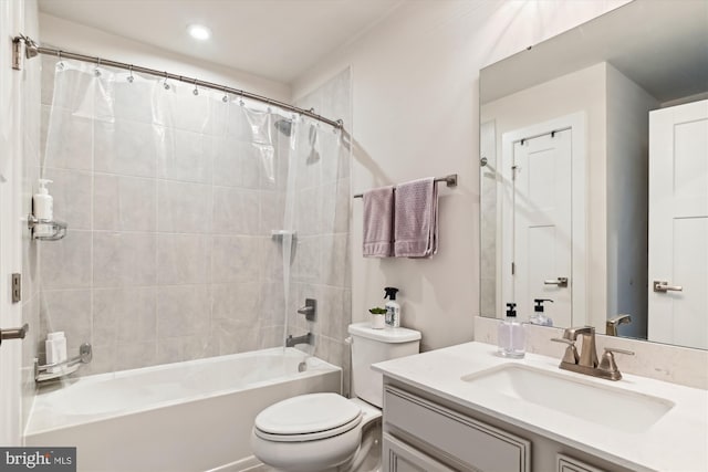 full bathroom with vanity, toilet, and shower / tub combo