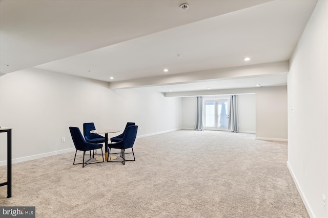 sitting room featuring light colored carpet