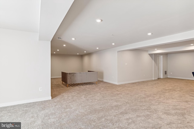 basement with light colored carpet