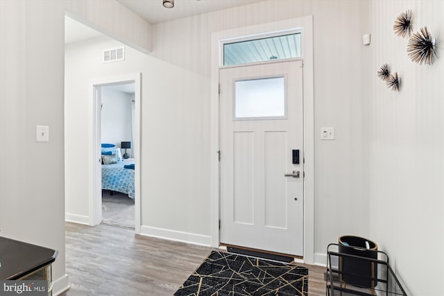 foyer with hardwood / wood-style floors