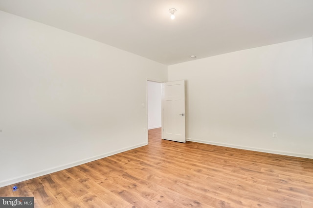 empty room with light wood-type flooring