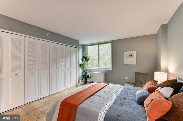 bedroom featuring a closet and light parquet flooring