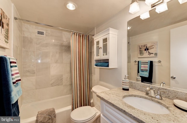 full bathroom with vanity, toilet, and shower / tub combo