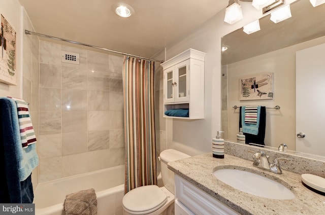 full bath featuring shower / bath combo, toilet, and vanity