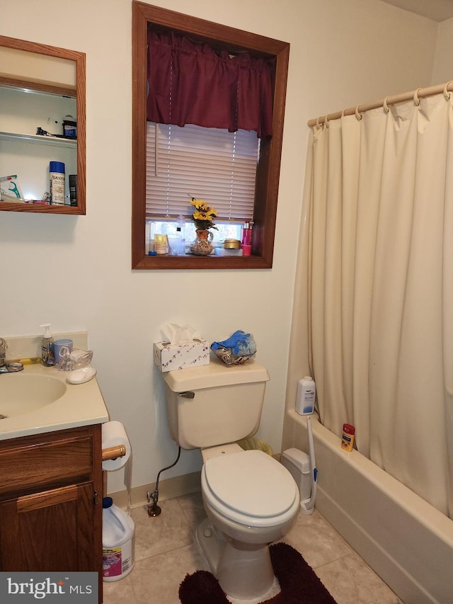 full bathroom featuring toilet, shower / bath combo, vanity, and tile patterned floors