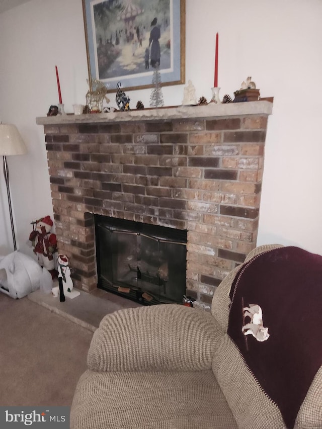 room details featuring carpet flooring and a fireplace