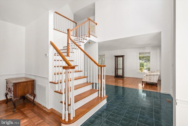 stairway featuring wood-type flooring