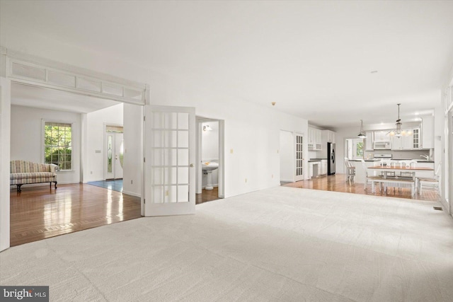 unfurnished living room featuring light hardwood / wood-style floors