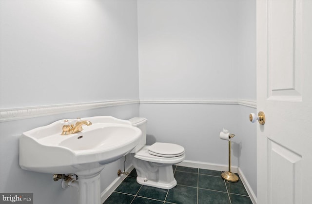 bathroom featuring tile patterned floors and toilet