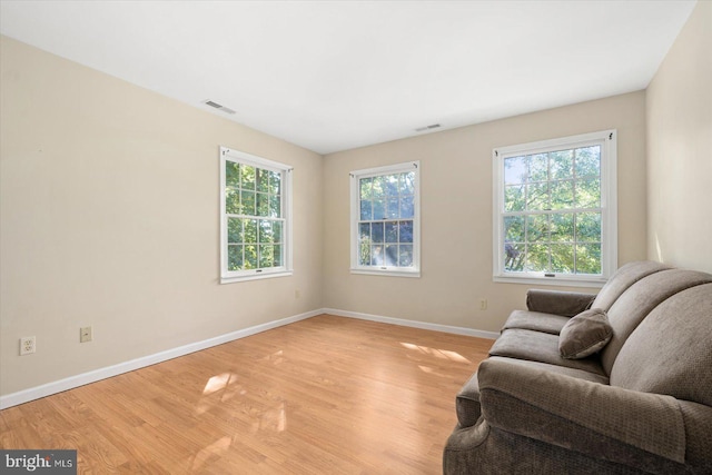 sitting room featuring light hardwood / wood-style floors