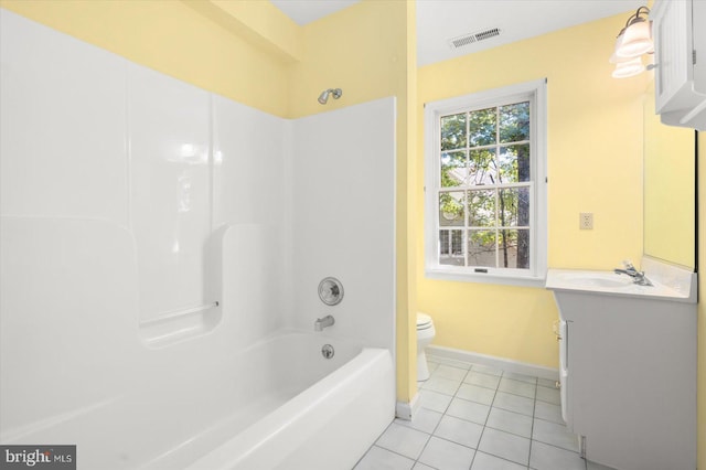 full bathroom featuring vanity, tile patterned flooring, toilet, and tub / shower combination