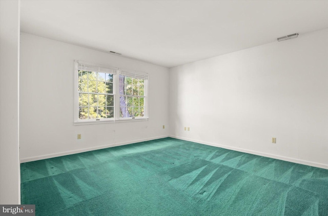 spare room featuring carpet