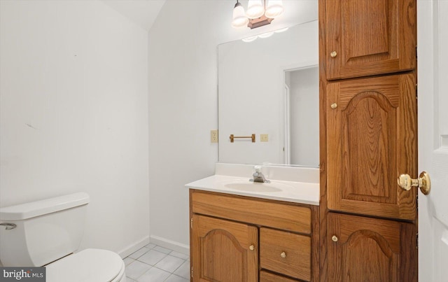 bathroom featuring vanity, toilet, and tile patterned floors