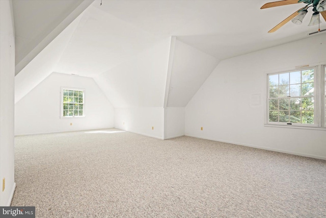 bonus room with ceiling fan, lofted ceiling, and carpet floors