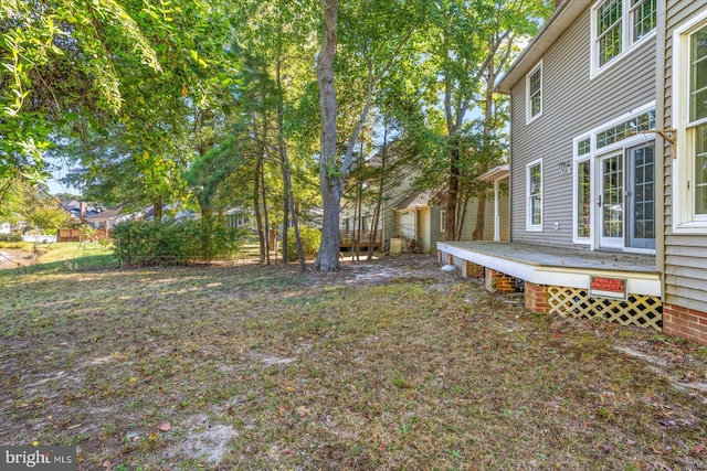 view of yard with a wooden deck