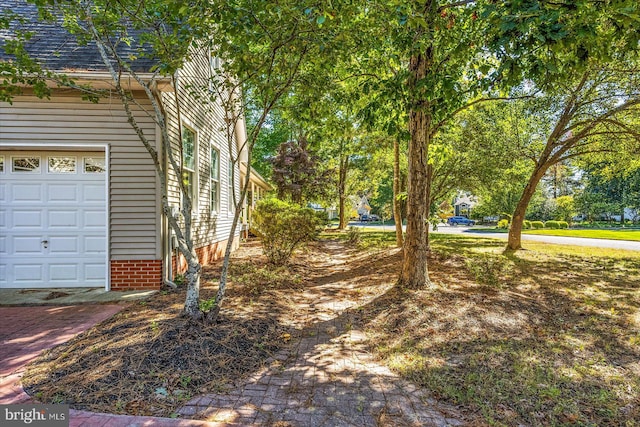 view of yard with a garage