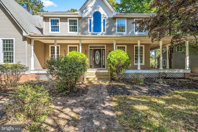 view of front of property featuring covered porch