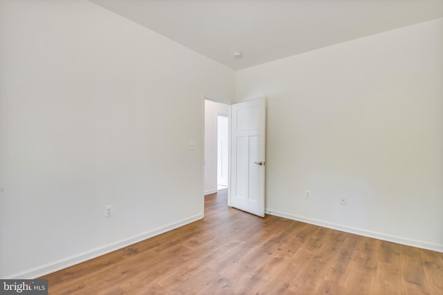 spare room featuring light hardwood / wood-style floors