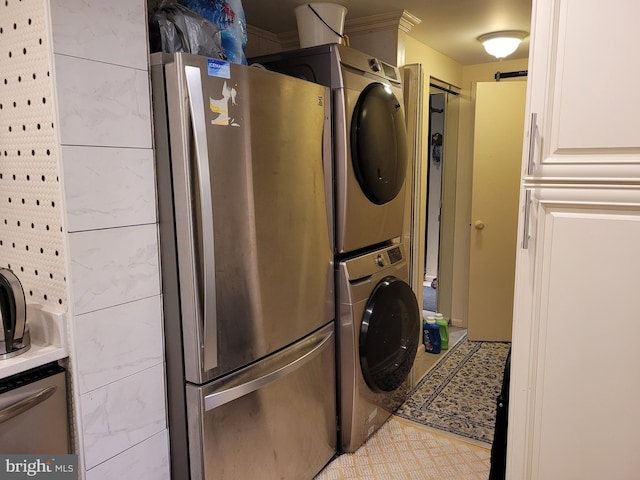 laundry area with stacked washer and dryer