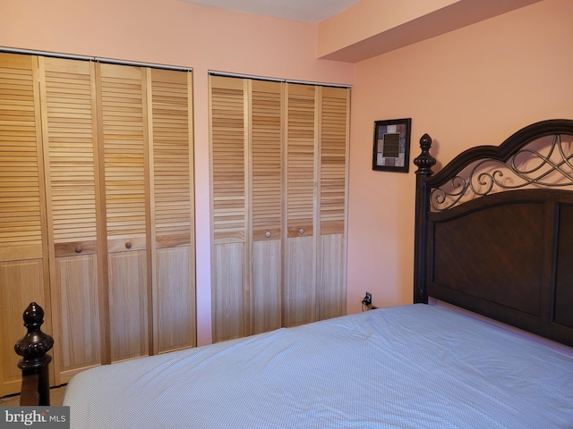 bedroom featuring multiple closets