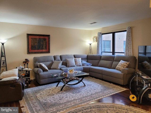 living room featuring dark wood-type flooring