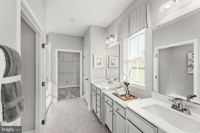 bathroom with vanity and tile patterned flooring