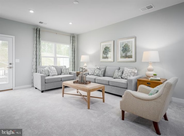 living room featuring light carpet