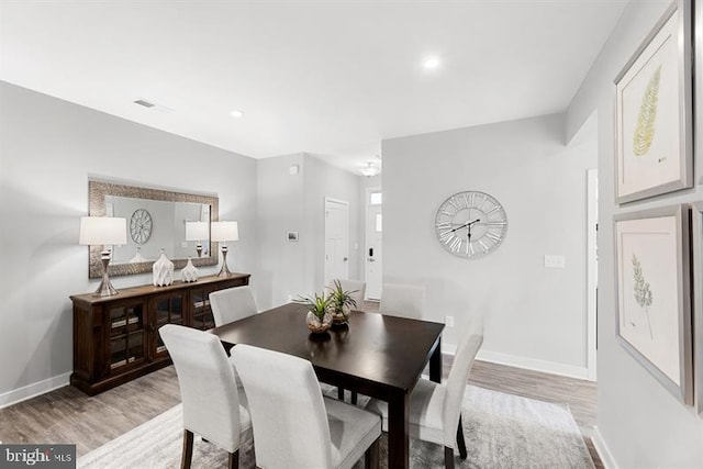 dining space featuring light hardwood / wood-style flooring