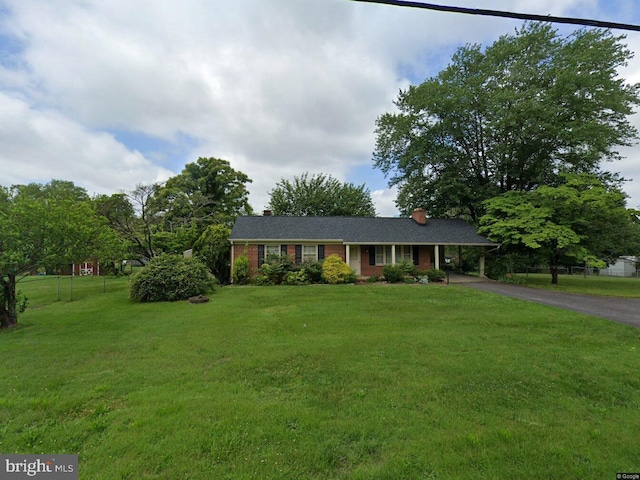 ranch-style home with a front yard