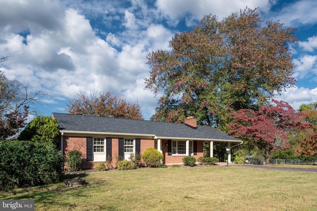 ranch-style home with a front lawn