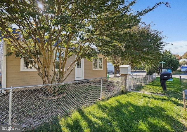 obstructed view of property with a front yard