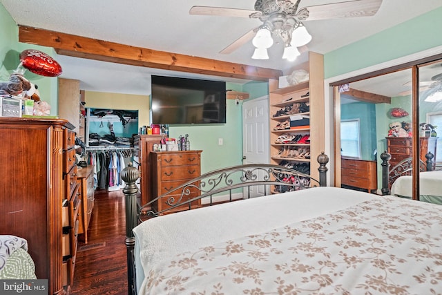 bedroom featuring dark hardwood / wood-style floors, a closet, beam ceiling, a textured ceiling, and ceiling fan