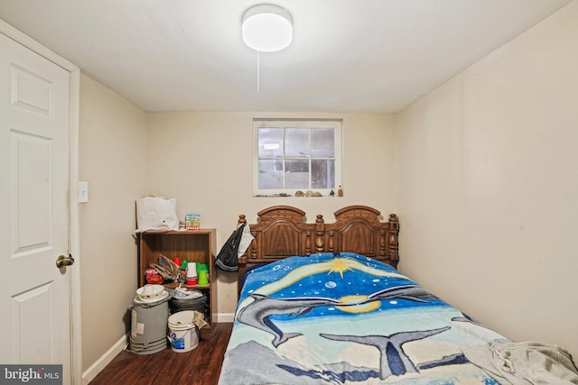 bedroom featuring dark wood-type flooring