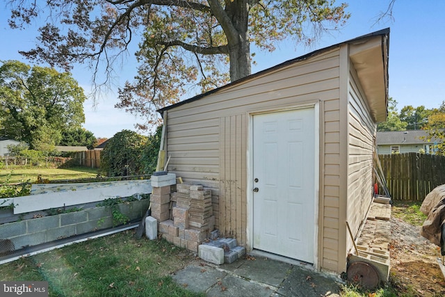 view of outbuilding with a lawn