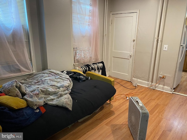 bedroom with light wood-type flooring