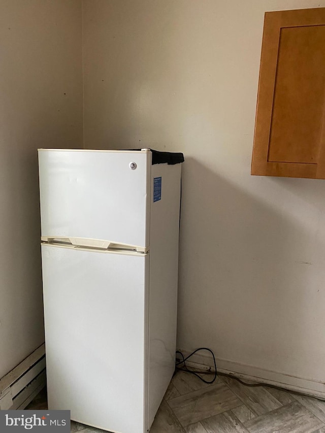 room details featuring white refrigerator and parquet floors