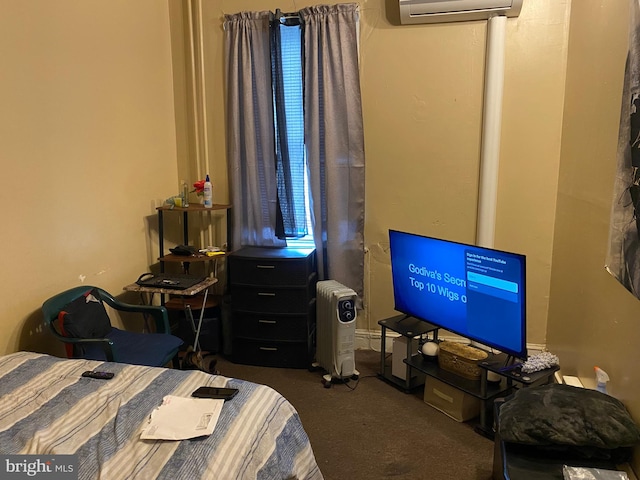 carpeted bedroom featuring a wall unit AC