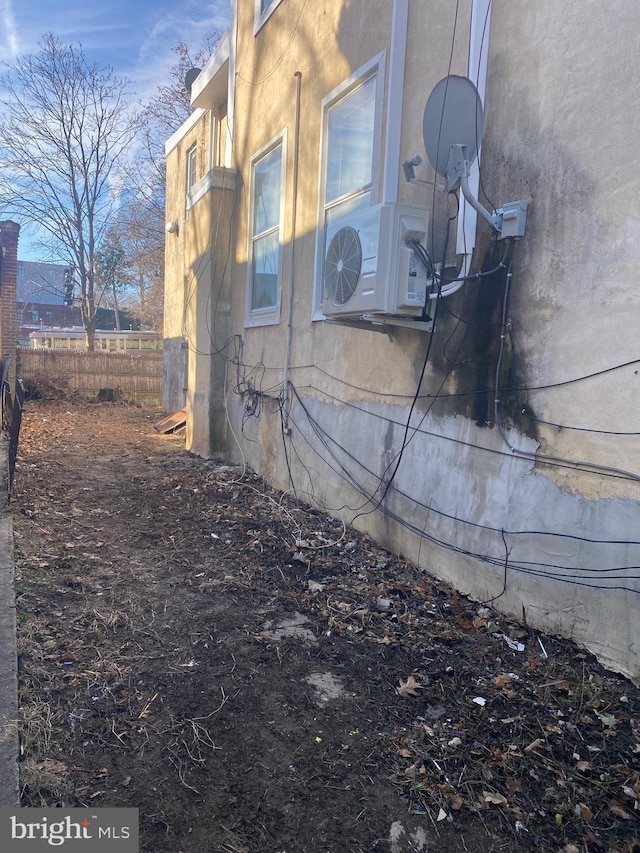 view of side of property with ac unit