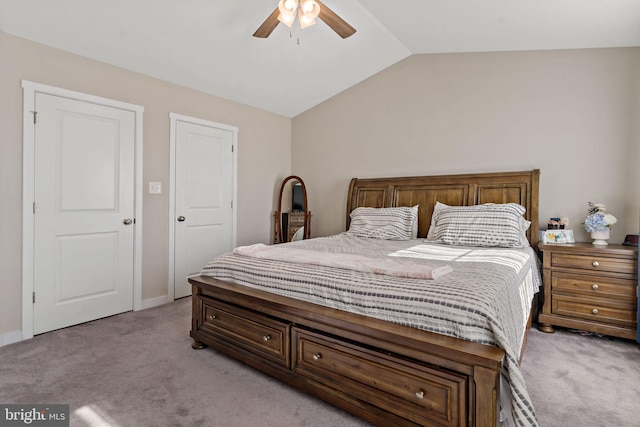 carpeted bedroom with lofted ceiling and ceiling fan