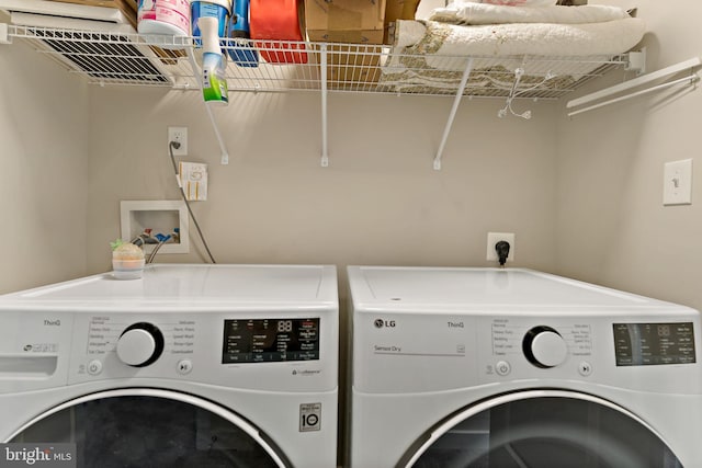 clothes washing area featuring independent washer and dryer