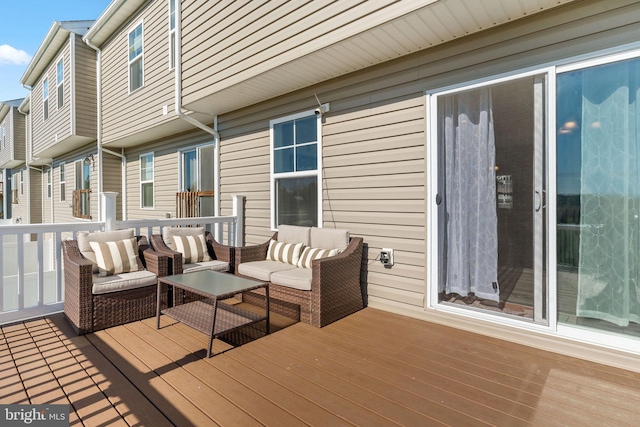 wooden terrace with outdoor lounge area