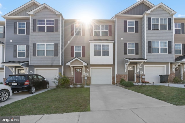 view of property with a garage and a front lawn