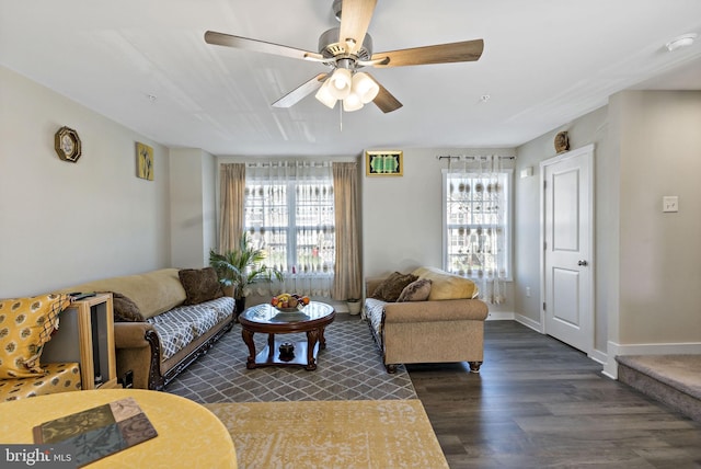 living room with ceiling fan, dark hardwood / wood-style floors, and plenty of natural light