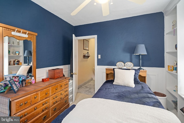 bedroom with light carpet and ceiling fan