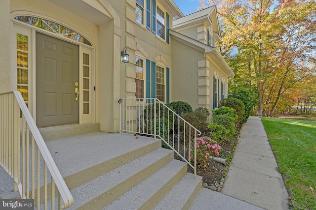 entrance to property with a yard