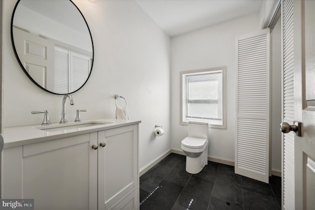 bathroom with tile patterned floors, vanity, and toilet