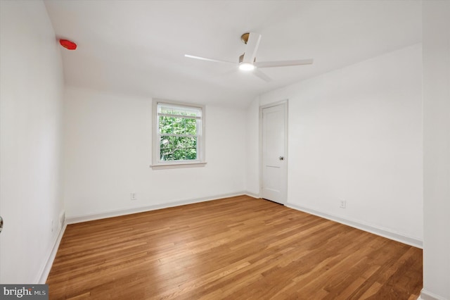 spare room featuring ceiling fan and hardwood / wood-style flooring